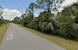 14212 Carney Ave on Paved Road. No HOA & Flood Zone 